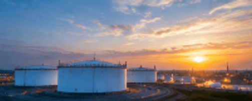 Strategic bulk oil and energy storage terminal tanks at sunset